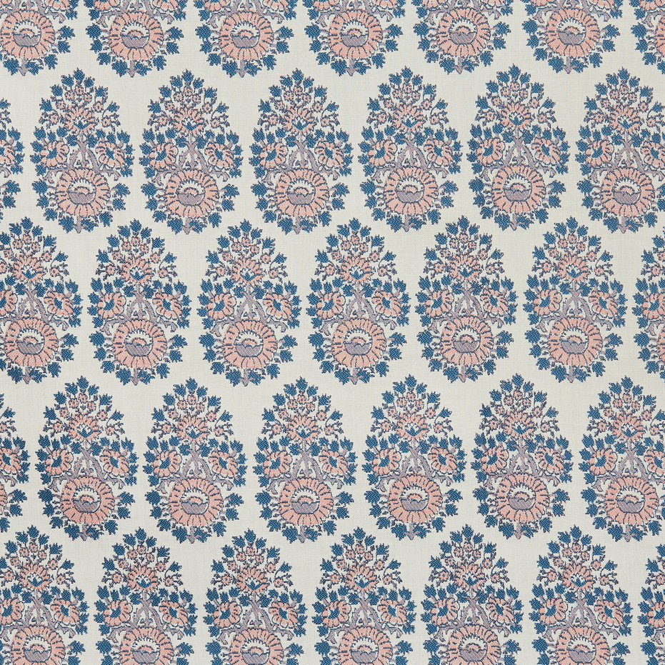 A blue and pink paisley pattern on a white background that showcases the Lanka Primrose Performance Fabric by John Robshaw, which highlights fabric-making traditions.