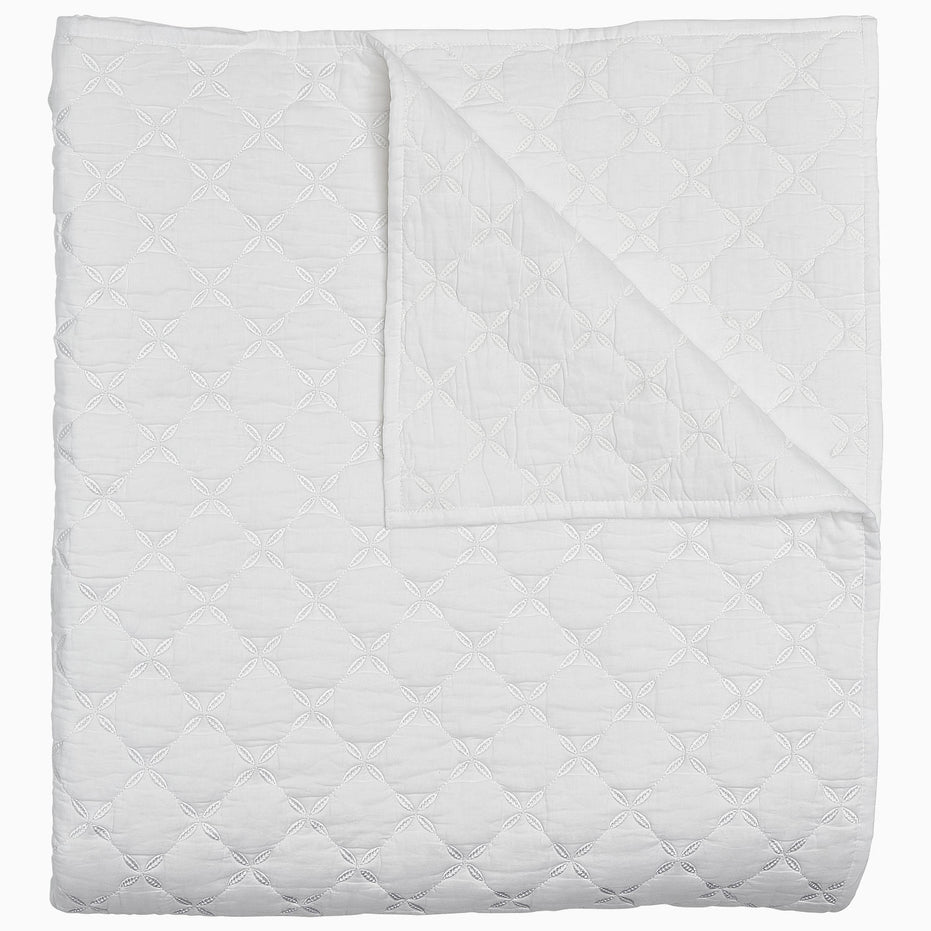 A Layla White Quilt by John Robshaw on a white background.