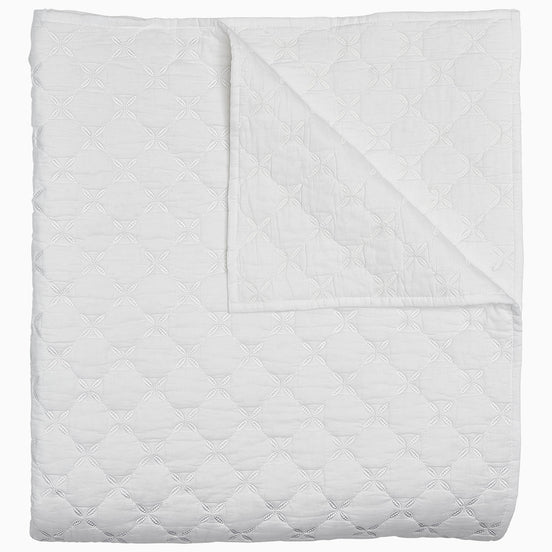 A Layla White Quilt by John Robshaw on a white background.