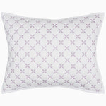 A Layla Lavender Quilt pillow with a cross design, made from cotton voile, by John Robshaw.