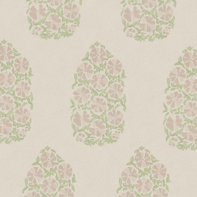 An oversized Saanya Sage Fabric wallpaper with green and pink flowers on it by John Robshaw.