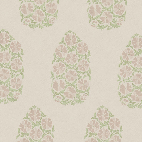 An oversized Saanya Sage Fabric wallpaper with green and pink flowers on it by John Robshaw.