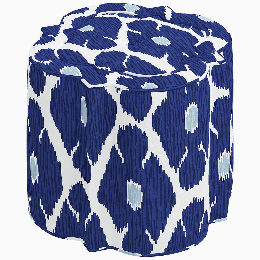 An interior Shiza Ottoman with a blue and white patterned swatch, from the John Robshaw brand.