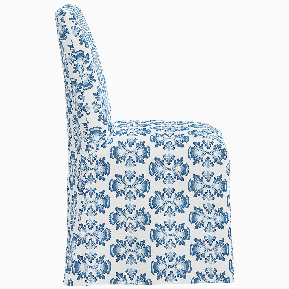 John Robshaw Sadia Slipcover Chair: A blue and white chair with a floral pattern.