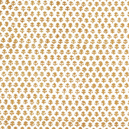 A Bindi Gold Fabric with a gold and white pattern on traditional hand block printed fabrics by John Robshaw.