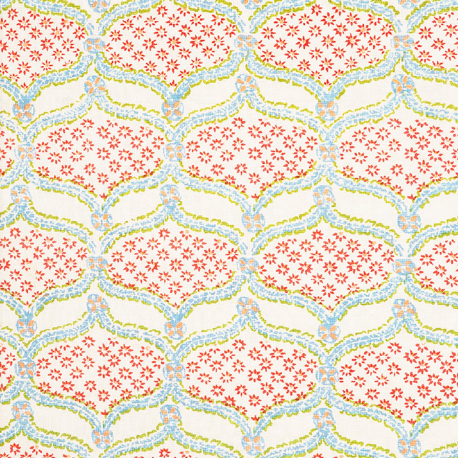 A pink and blue floral pattern on a white background, created using Hasati Lotus Fabric by skilled artisans from John Robshaw.