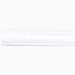 A white Stitched White Organic Sheets with embroidered designs on top of a white John Robshaw surface. - 30252488720430