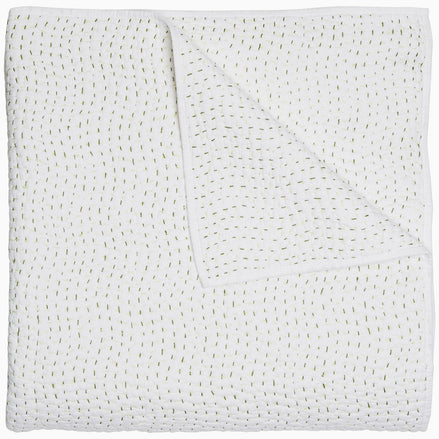 A John Robshaw Organic Hand Stitched Moss Quilt with hand stitched, gold dots on it.