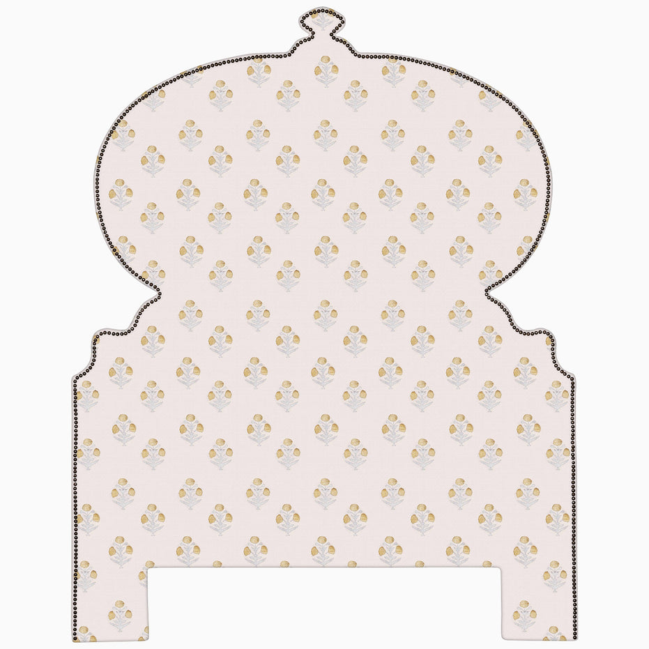 An image of a pink and gold patterned John Robshaw Custom Orissa Headboard with Mughal architecture influences.