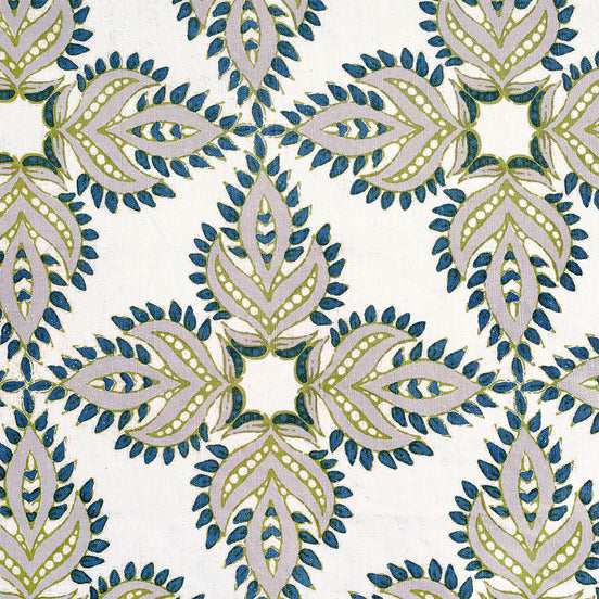 A Diba Peacock Fabric by John Robshaw, hand block printed with a blue and green floral pattern on a white background, featuring a protective symbol known as nazar.