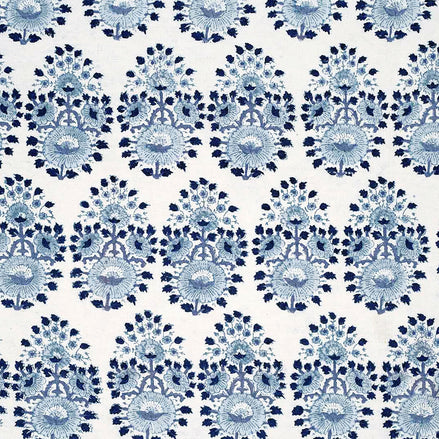 A blue and white floral pattern, created through traditional craftsmanship using Lanka Lapis Fabric by John Robshaw.