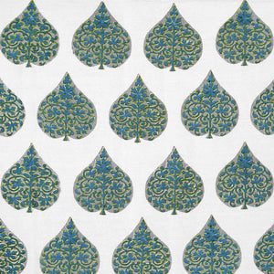 A hand block printed Ratana Peacock fabric in blue and green leaf pattern on a white linen/cotton blend fabric, showcasing traditional craftsmanship by John Robshaw.