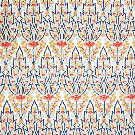 A hand block printed Marmar Kashmir Fabric blue and orange floral pattern, inspired by Mughal gardens, by John Robshaw.
