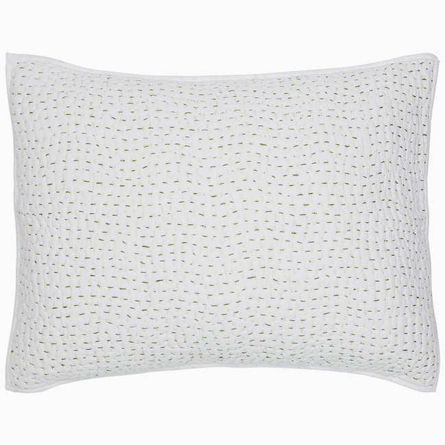 A white Organic Hand Stitched Moss Quilt pillow with hand stitched green dots on organic cotton voile by John Robshaw.